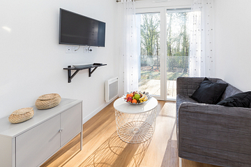 Camping des Gayeulles, Citylodge Odorico, salon ©Simon Bourcier
