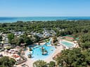 Le Logis Campsite -Waterpark- Aerial view of the waterpark with the sea in the background
