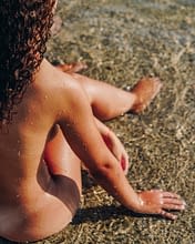 Domaine de Bagheera, Strand, eine Frau im Wasser