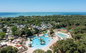 Le Logis Campsite -Waterpark- Aerial view of the waterpark with the sea in the background