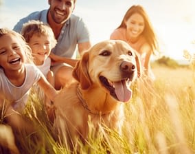 Smiling family with a dog