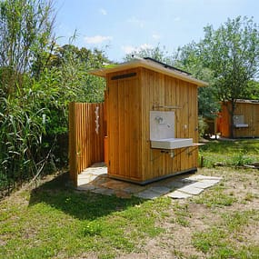 Beauregard Plage Campsite -  Caban O Spa Premium Camping Pitch - View of pitch and private sanitary facilities
