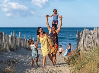 Le Brasilia campsite, family returning from the beach