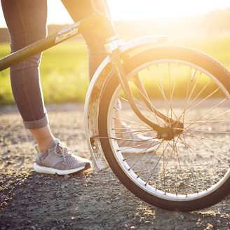 Woman riding a bicycle- Bike rental - Country Park Campsite Crécy-la-Chapelle