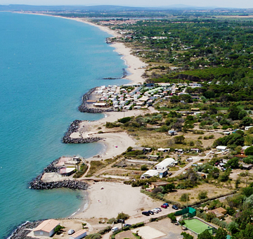 Camping Californie Plage - The swimming pool area - aerial view of the campsite and the sea