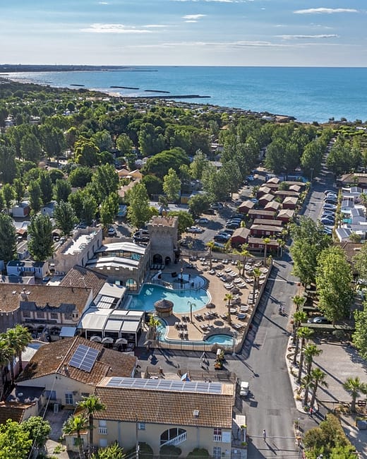 Camping Californie Plage - The campsite area - Aerial view of the swimming pool area and the sea
