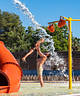 Campingplatz La Sirène - Aquapark - Planschbecken - Badelandschaft - Vater und Tochter unter einem Wasserstrahl